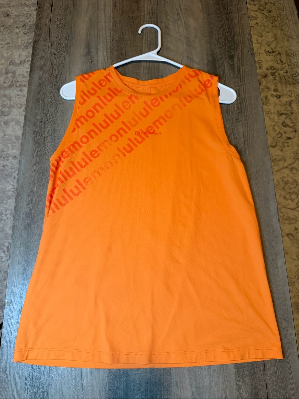 Lululemon Bright Orange Tank with Subtle Logo Print *best for size 6-8*